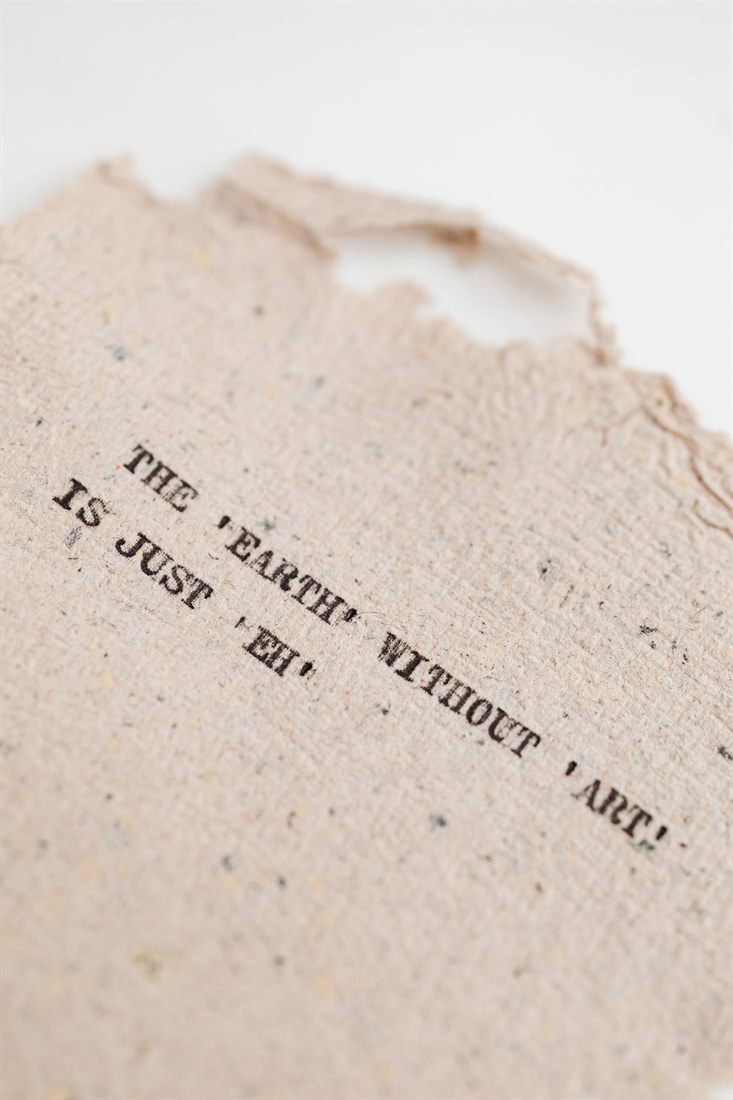 Letterpress type reading 'The earth without art is just eh' on handmade paper